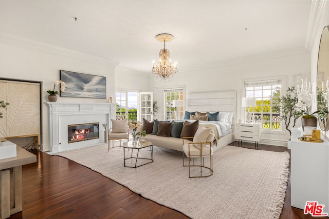 bedroom with an inviting chandelier, dark hardwood / wood-style floors, crown molding, and multiple windows