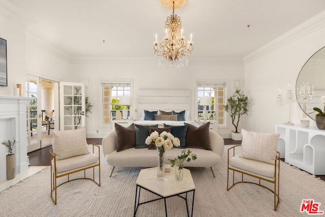 bedroom with light hardwood / wood-style floors, crown molding, and a notable chandelier