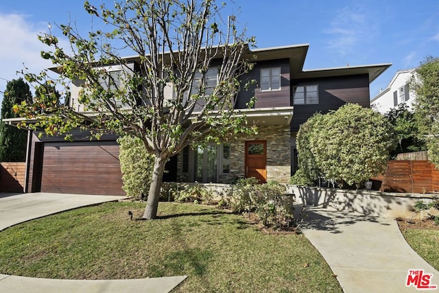 modern home with a garage and a front yard