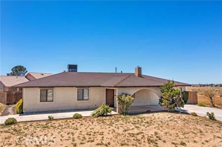 ranch-style house with a patio