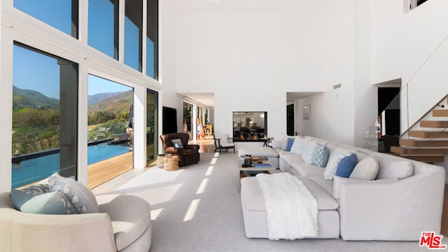 living room with a mountain view and a high ceiling