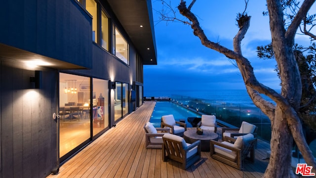 deck at dusk with a water view