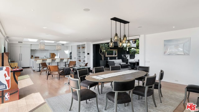 dining room with light wood-type flooring