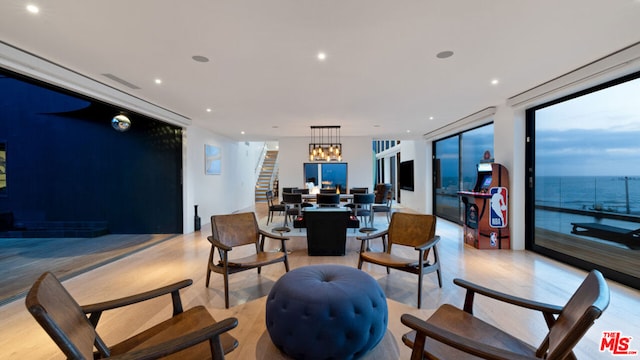 interior space featuring expansive windows and an inviting chandelier