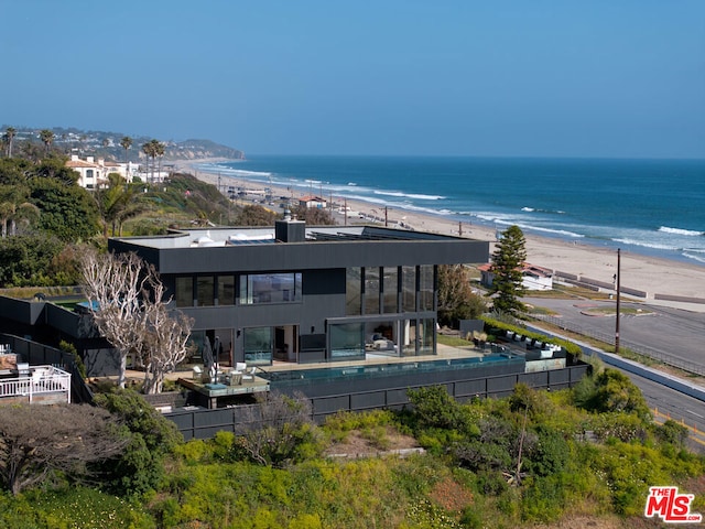 drone / aerial view with a view of the beach and a water view