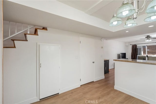 kitchen featuring light wood-type flooring and ceiling fan