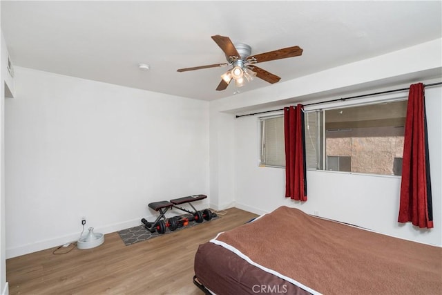 bedroom featuring ceiling fan and hardwood / wood-style floors