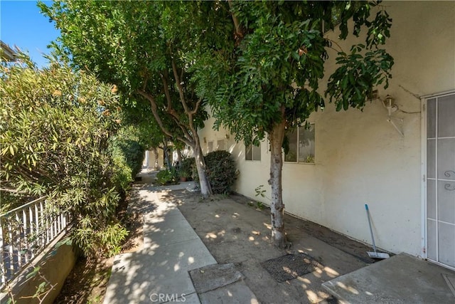 view of side of property with a patio area