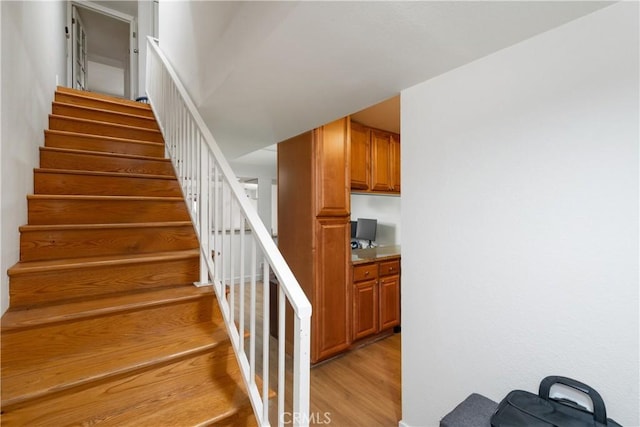 stairs with wood-type flooring