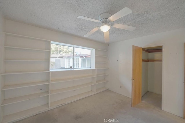 unfurnished bedroom with a textured ceiling, ceiling fan, and a closet