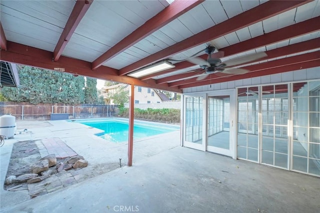 view of pool featuring ceiling fan, a sunroom, and a patio