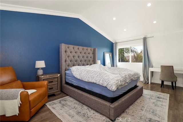 bedroom featuring dark wood-type flooring, crown molding, and vaulted ceiling