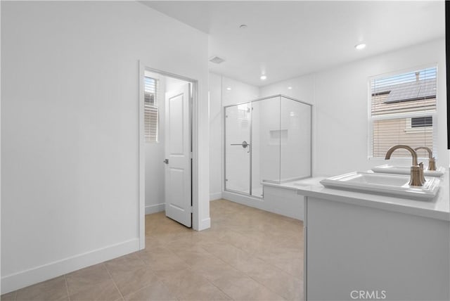 bathroom featuring tile patterned flooring, sink, and a shower with door