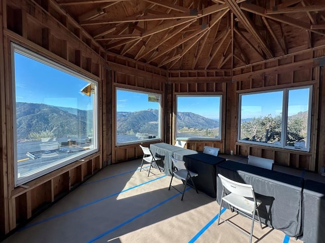 unfurnished sunroom featuring a mountain view