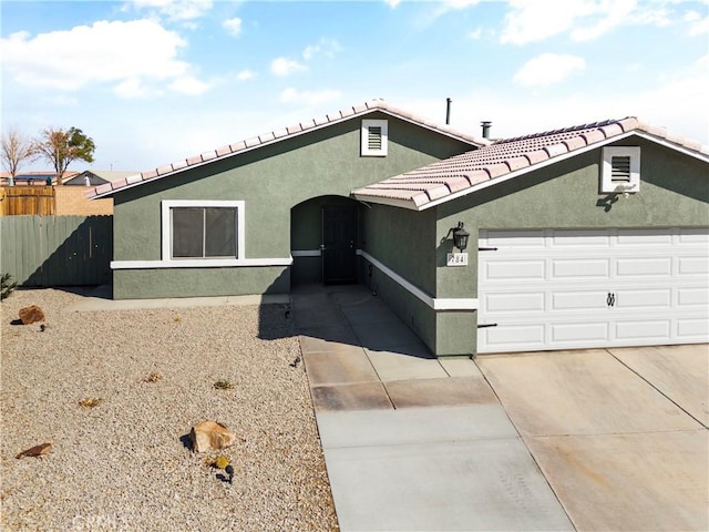 ranch-style home featuring a garage