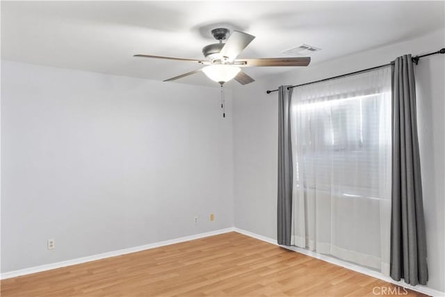 unfurnished room with ceiling fan and light hardwood / wood-style flooring