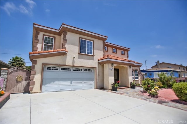 mediterranean / spanish house featuring a garage