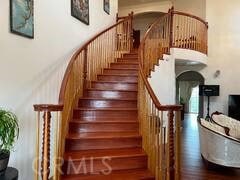 stairs with hardwood / wood-style flooring