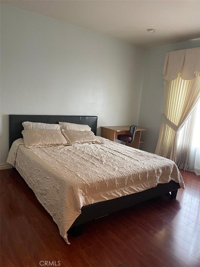 bedroom featuring dark hardwood / wood-style floors