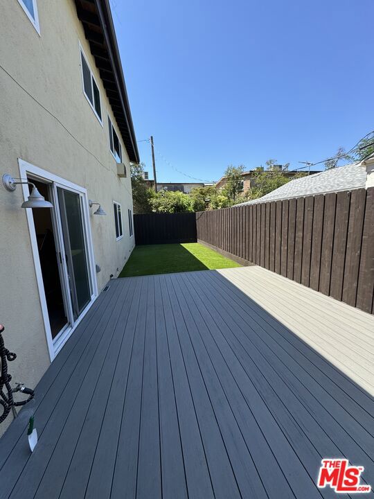 wooden deck with a yard