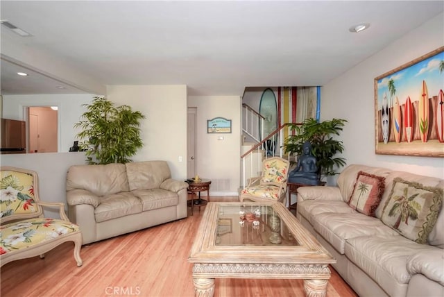 living room with light hardwood / wood-style floors