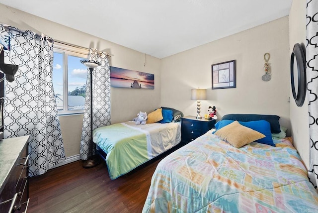 bedroom featuring dark hardwood / wood-style flooring