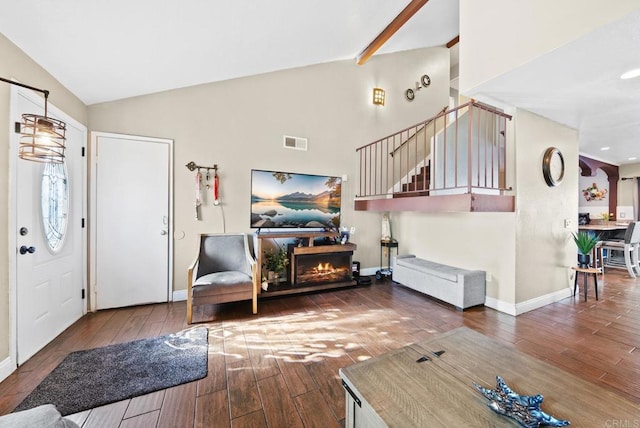 entrance foyer with vaulted ceiling and dark wood-type flooring