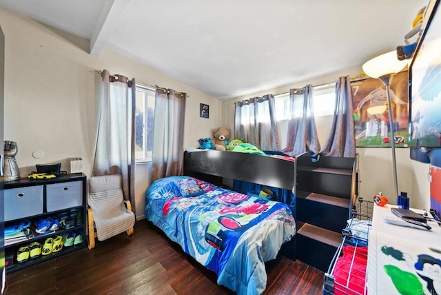 bedroom with dark hardwood / wood-style floors and beamed ceiling