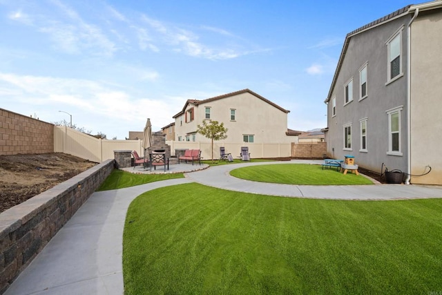 view of yard with a fireplace