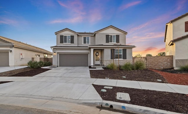 front of property with a garage