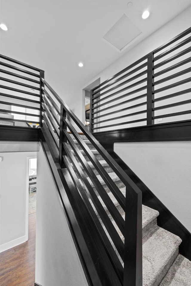 stairway featuring hardwood / wood-style floors