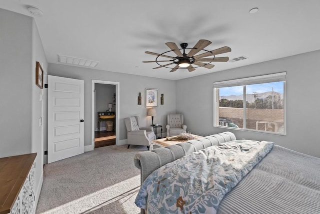 bedroom featuring a ceiling fan, baseboards, visible vents, and carpet floors