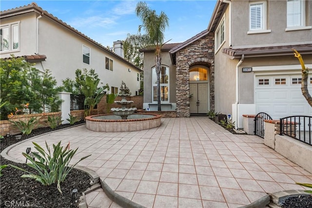 rear view of house with a garage