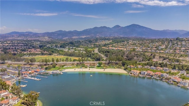 drone / aerial view with a water and mountain view