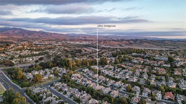 bird's eye view with a residential view and a mountain view