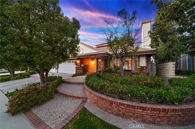 view of front of property with a garage