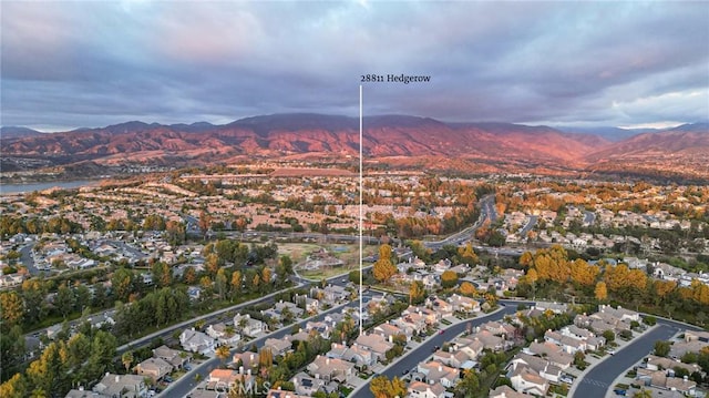 drone / aerial view featuring a residential view and a mountain view