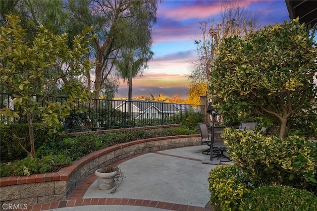 view of patio featuring fence