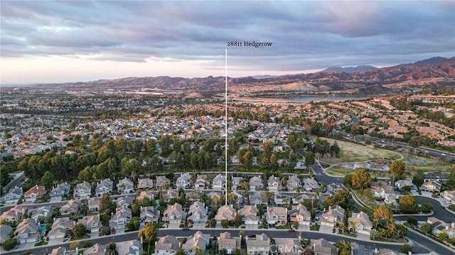 drone / aerial view with a mountain view and a residential view