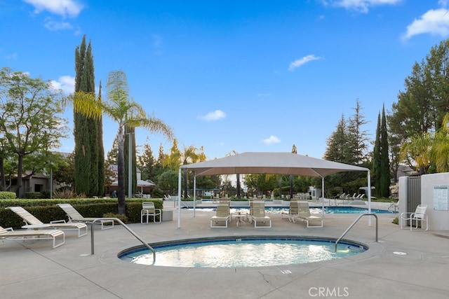 pool with a patio area