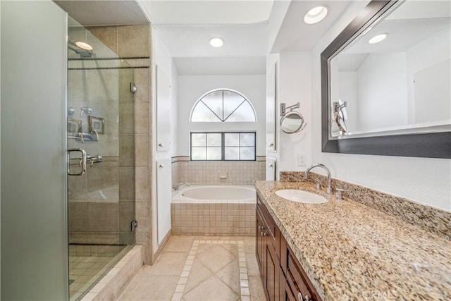 bathroom with vanity, recessed lighting, a stall shower, tile patterned flooring, and a bath