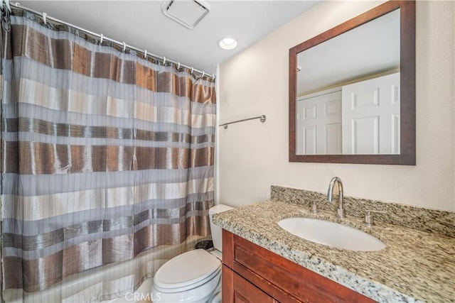 bathroom featuring visible vents, toilet, vanity, and shower / bath combination with curtain