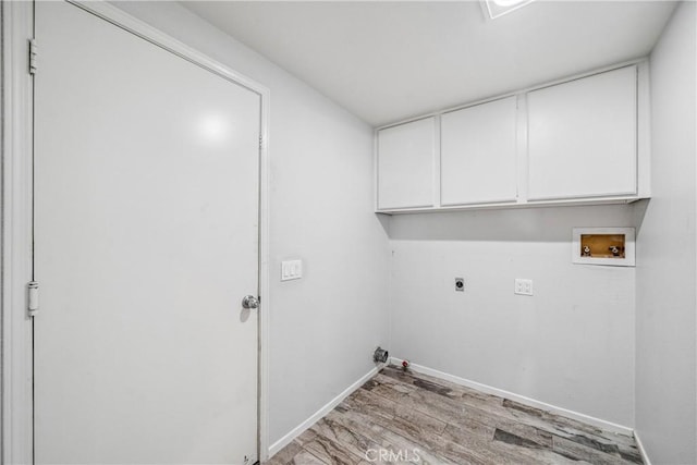 laundry room featuring light wood finished floors, baseboards, washer hookup, cabinet space, and electric dryer hookup