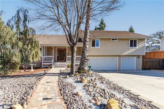 view of front of property featuring a garage and a porch