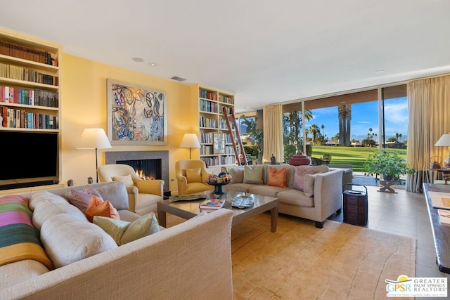 living room with floor to ceiling windows