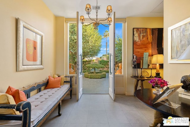 entryway featuring an inviting chandelier