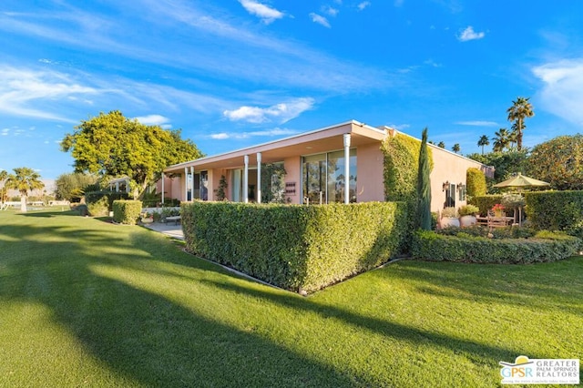 view of home's exterior featuring a lawn