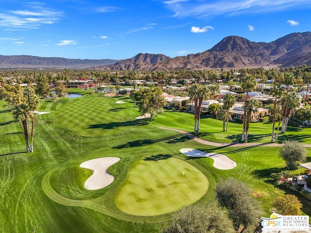 surrounding community with a water and mountain view