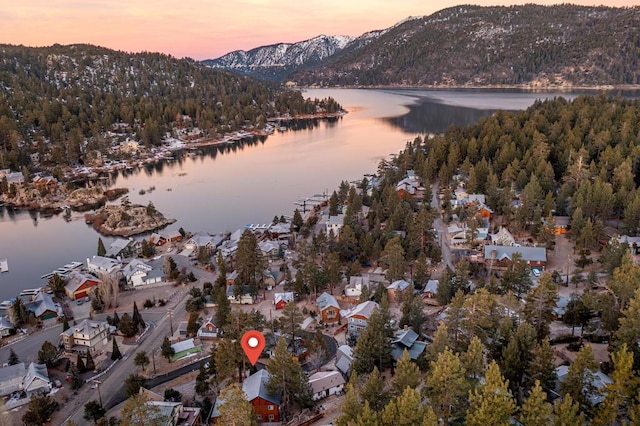 aerial view at dusk with a water and mountain view