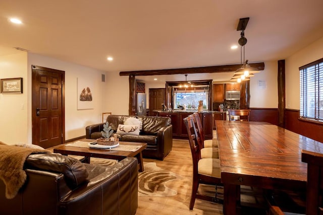 dining space with light wood-type flooring